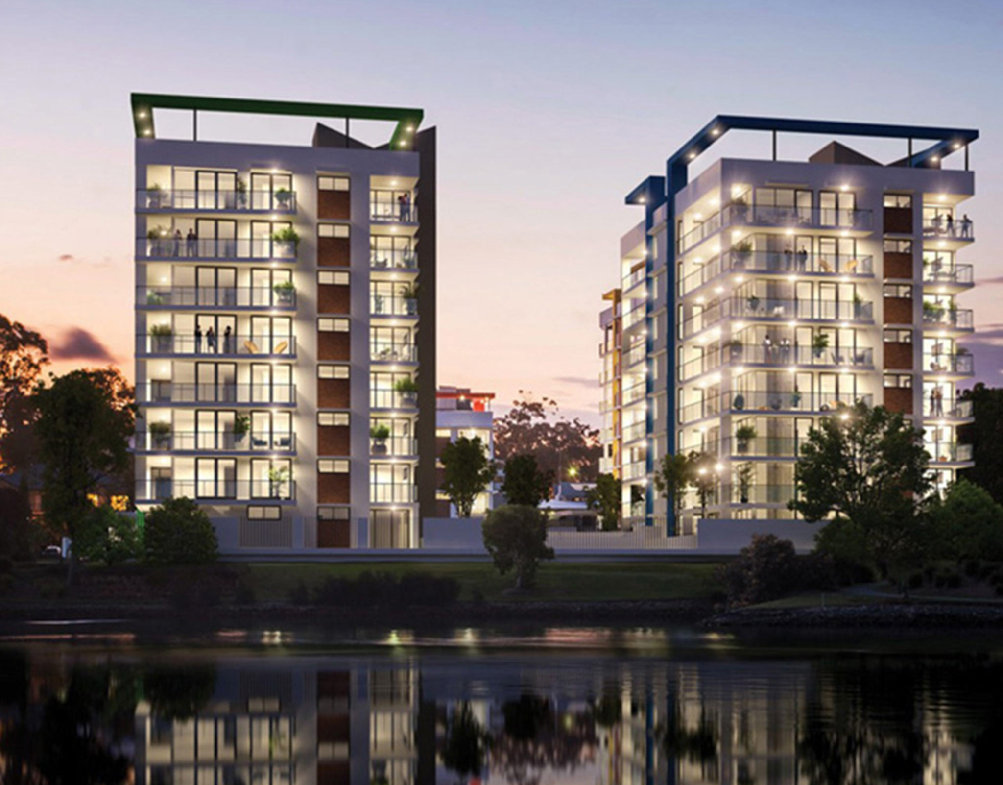 Dusk rendering of two residential towers reflected in a river with glazed balconies lit from within